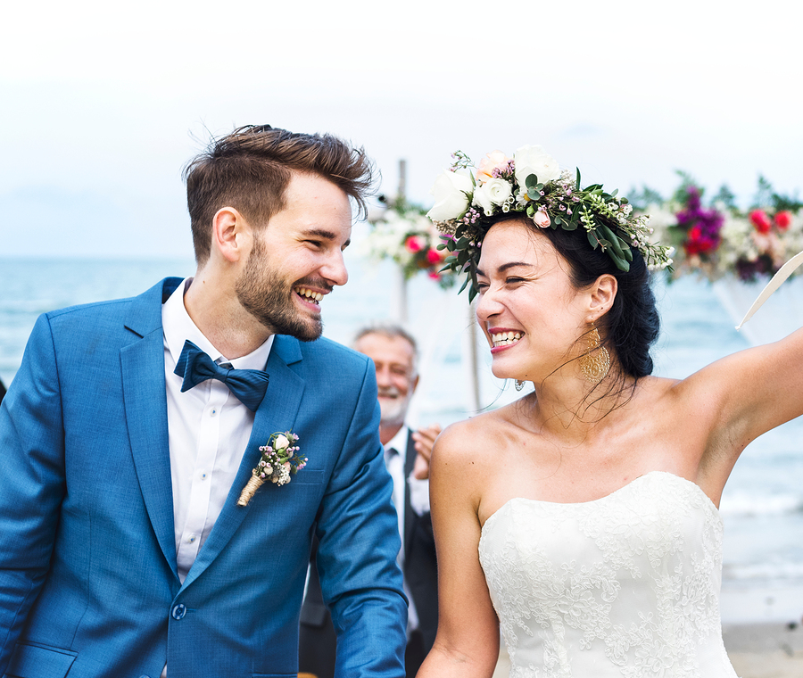 Happy couple at the beach wedding ceremony