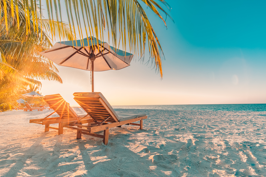 Perfect sunset beach. Idyllic tropical beach landscape for background or wallpaper. Design of summer vacation holiday concept. Luxury resort hotel background, romantic couple or honeymoon getaway, travel destination