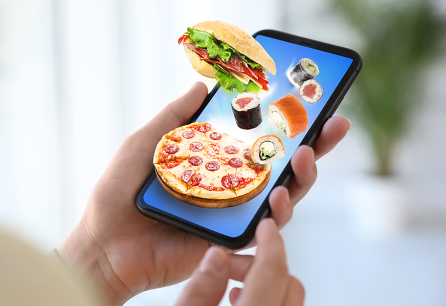 Woman using smartphone for ordering food online, closeup. Delivery service during quarantine