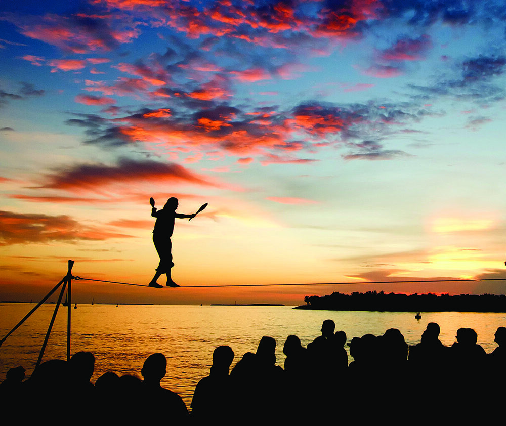 Will Soto performs a juggling and high-wire act at the Sunset Celebration in Key West, Fla. Soto has been entertaining for over 30 years at the nightly celebration in Mallory Square that draws crowds of people to watch buskers perform, browse vendors’ wares and applaud as the sun sinks below the horizon beyond Key West Harbor. Photo by Rob’ONeal/Florida Keys News Bureau