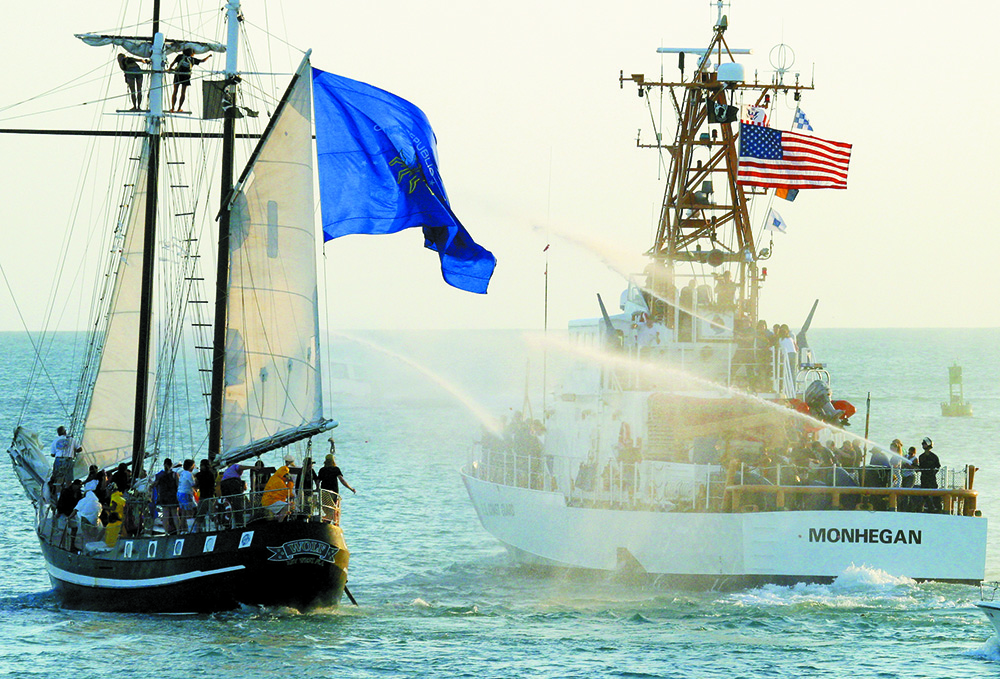 The U.S. Coast Guard cutter Monhegan fires upon the Conch Republic's flagship, the Schooner Wolf during ther 2004 Bloody Battle in Key West Harbor.