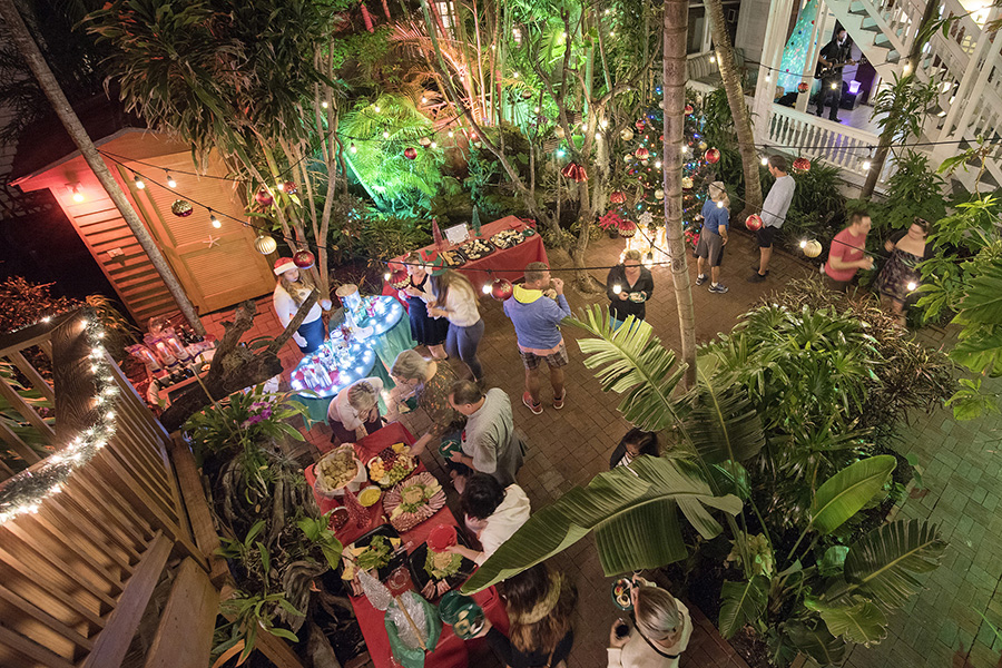 Holiday Historic Inn Tour guests feast on a bounty of holiday cheer Friday evening at the Island City House Hotel. Built in the late 1800’s the Hotel was one of five locations visited and explored by revelers during the December 15 Holiday Historic Inn Tours, presented by Margaritaville Key West Resort & Marina, Ocean Key Resort & Spa, Historic Tours of America, Lodging Association of the Florida Keys & Key West and the Monroe County Tourist Development Council. For more information on the annual Inn Tours and other Key West Holiday Fest events and happenings contact the Lodging Association at 305-296-4959 or visit KeyWestHolidayFest.com. (Photo Courtesy KeyWestHolidayFest.com)