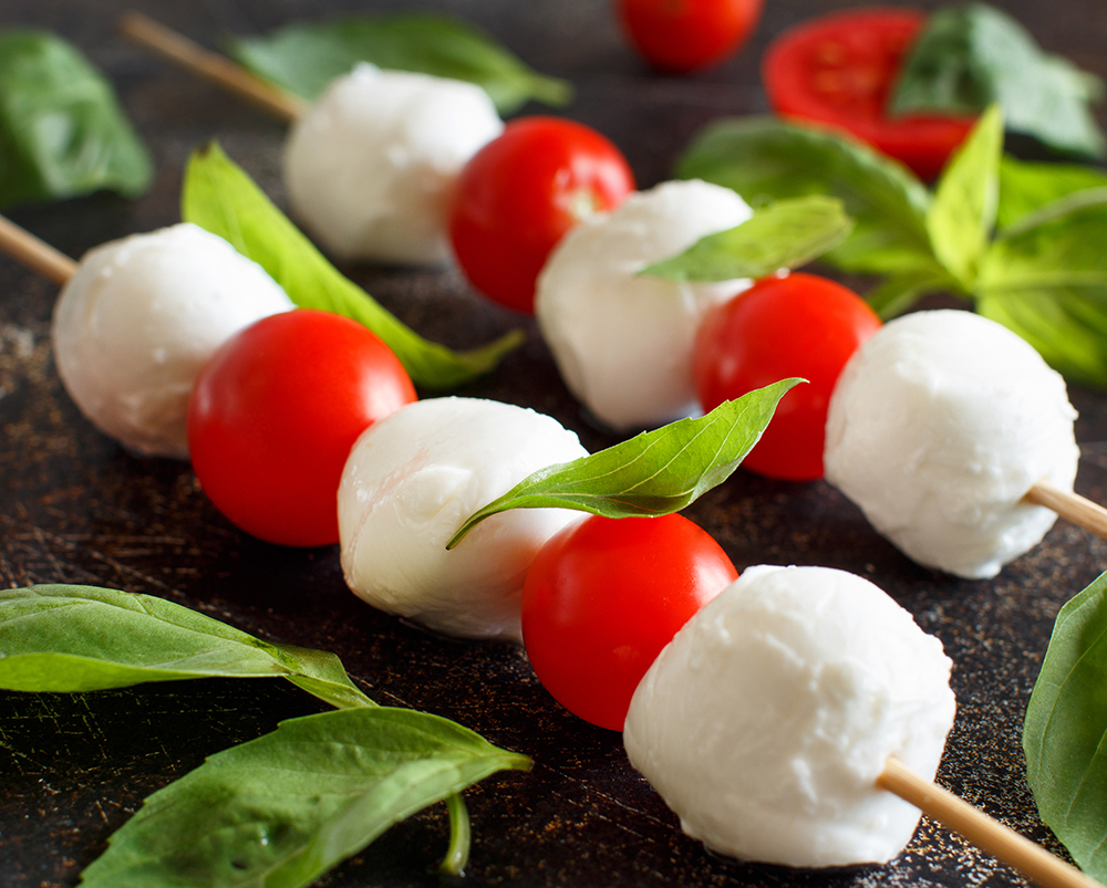 Italian cheese mozzarella with tomatoes and basil - caprese skewers